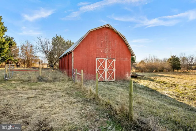 a balcony with furniture and wooden floor