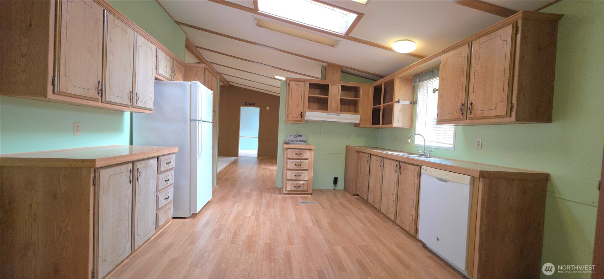 17 Rustemeyer Road, Unit 10 Aberdeen, WA 98520 - Photo 14 of 22 a kitchen with a wooden floor and cabinets