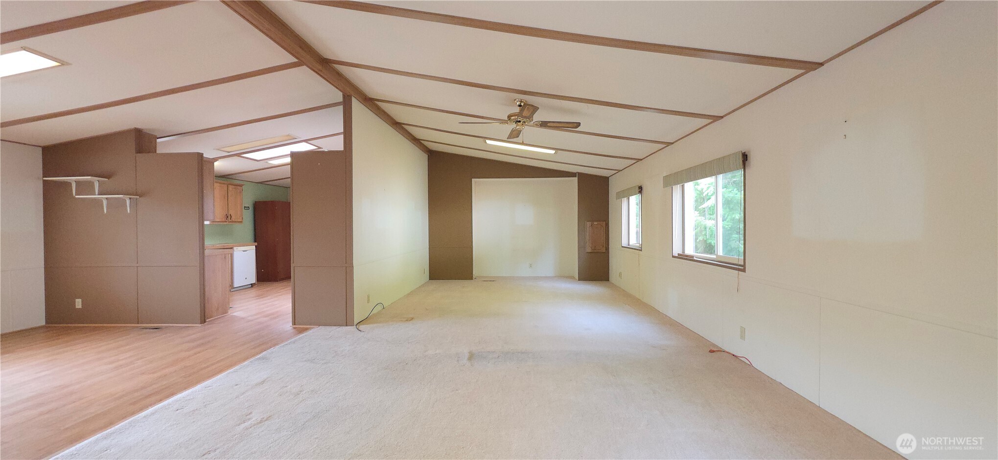 17 Rustemeyer Road, Unit 10 Aberdeen, WA 98520 - Photo 6 of 22 a view of a big room with wooden floor and windows