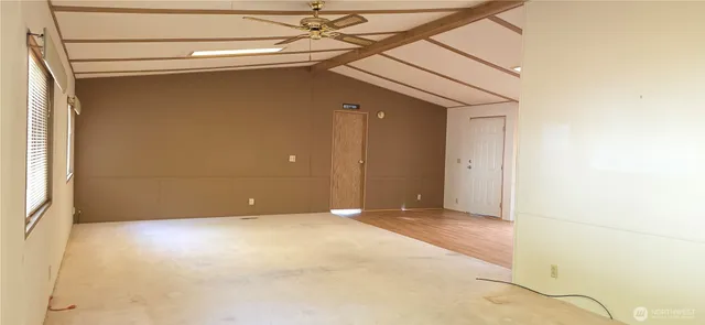 a view of empty room with windows