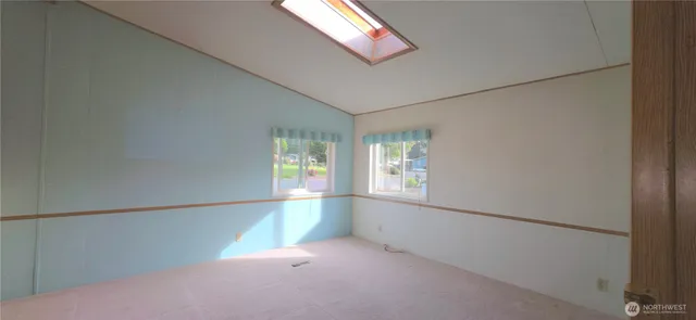 a view of a living room with a large window
