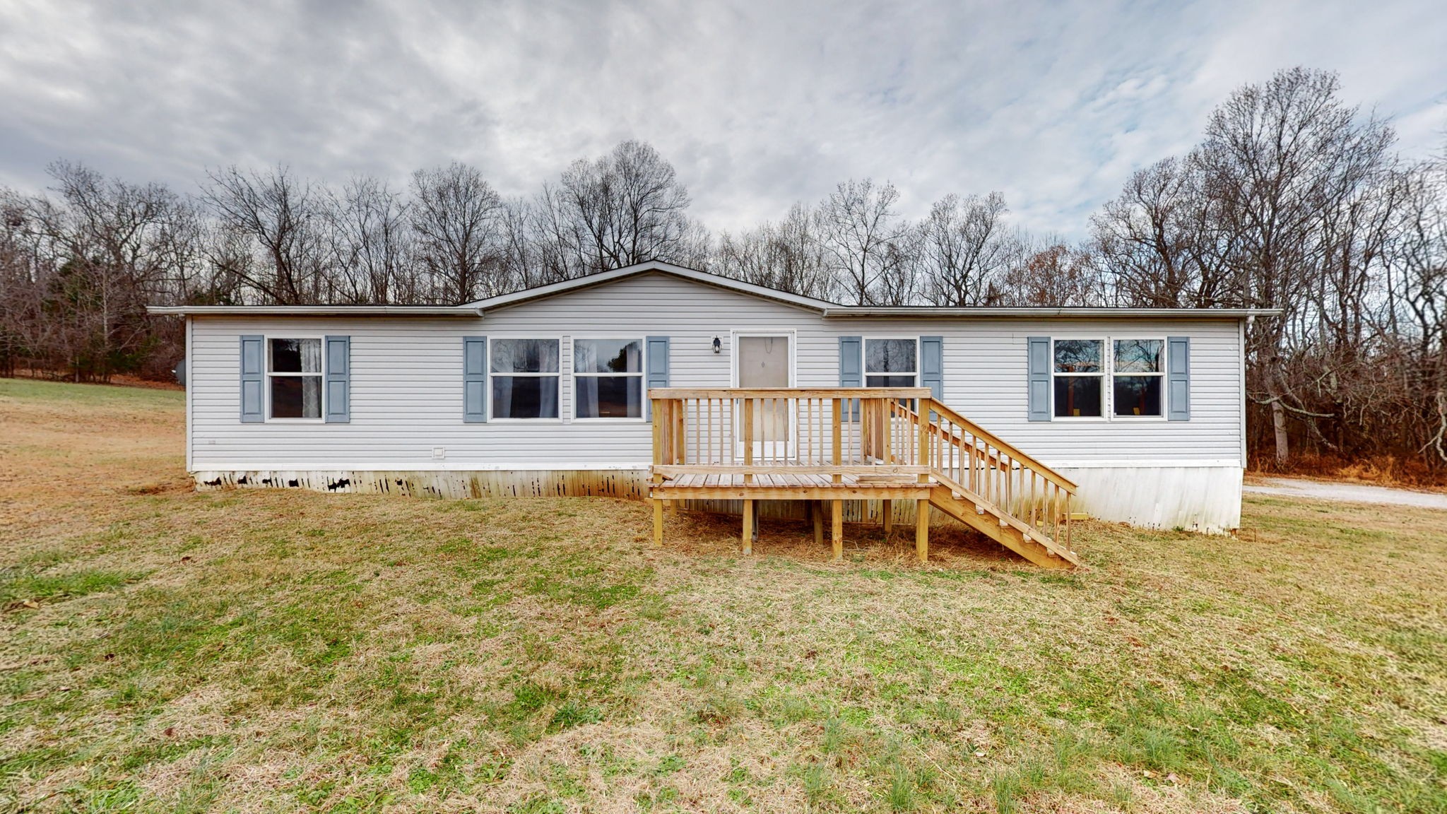a house with trees in the background