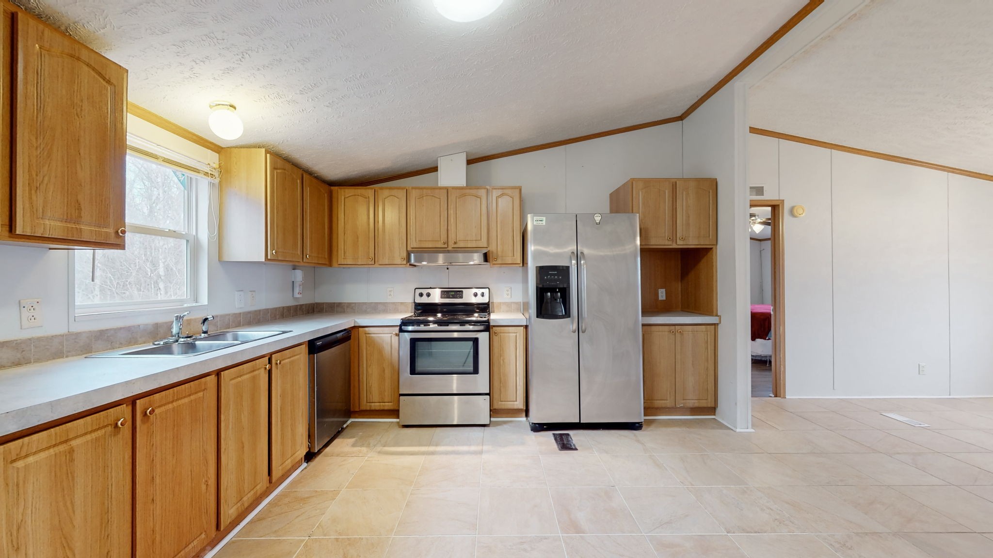 1118 Drake Road Clarksville, TN 37043 - Photo 13 of 38 a kitchen with stainless steel appliances granite countertop a refrigerator sink and stove