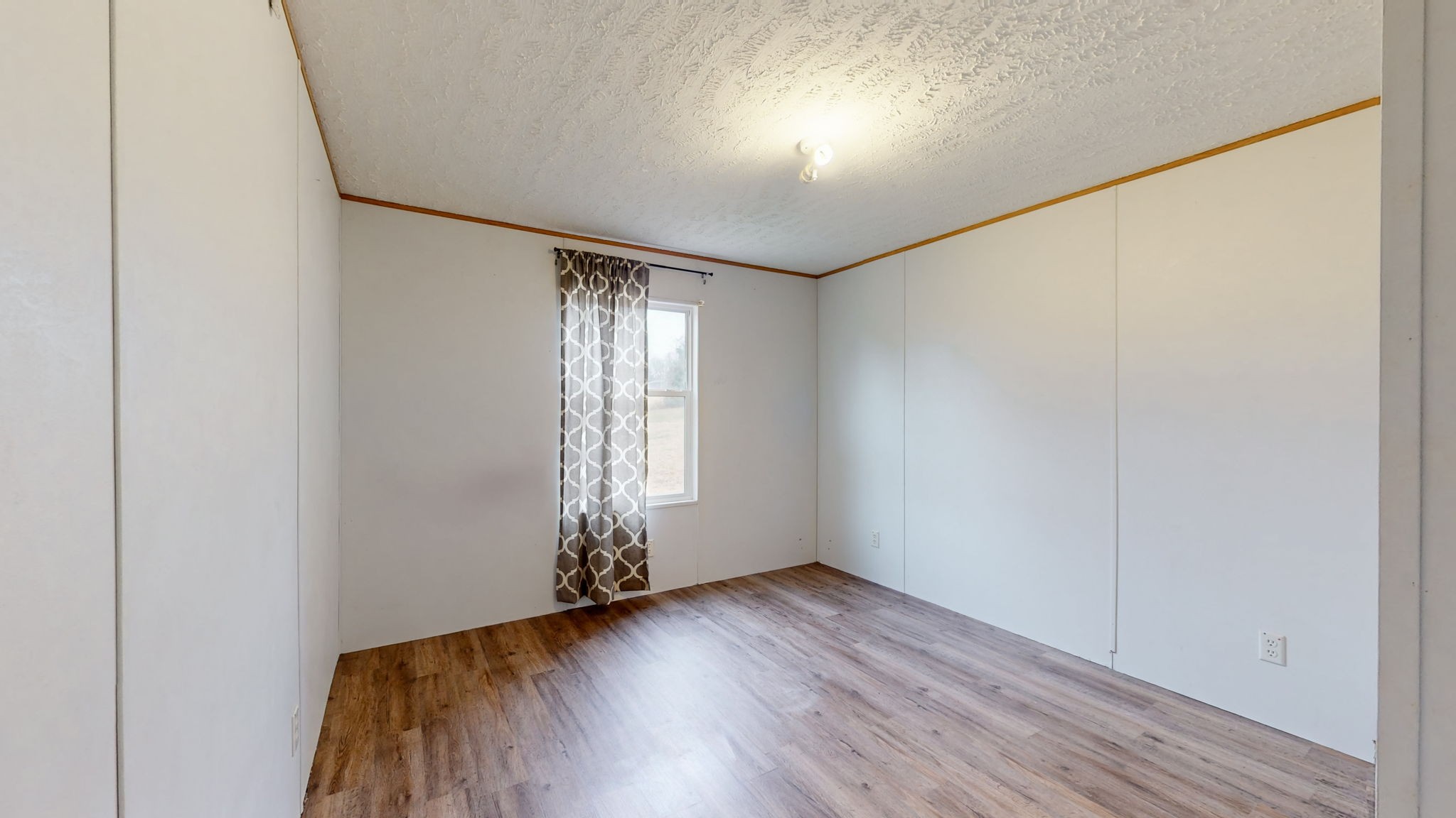 1118 Drake Road Clarksville, TN 37043 - Photo 20 of 38 an empty room with wooden floor and windows