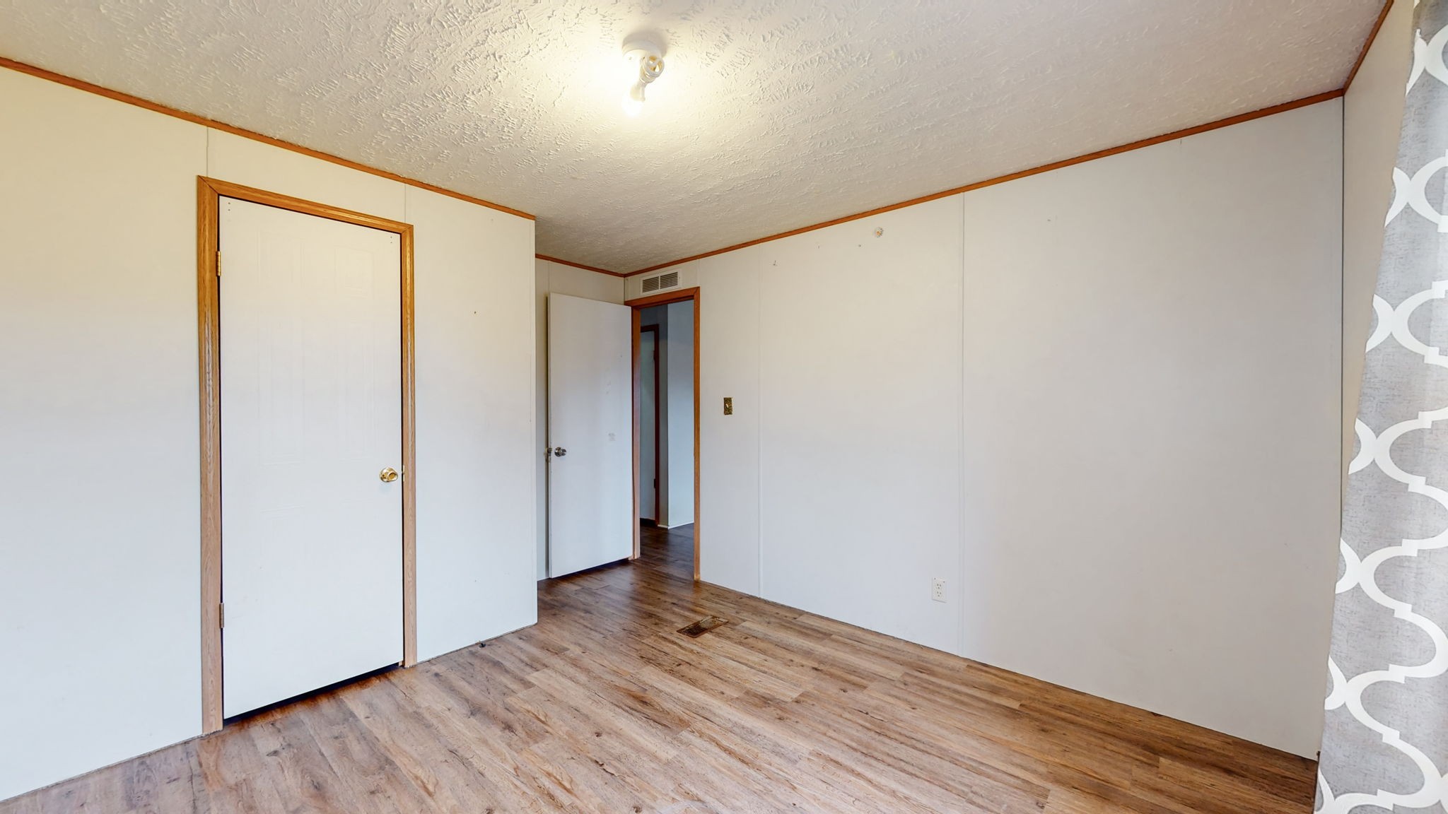 1118 Drake Road Clarksville, TN 37043 - Photo 21 of 38 a view of an empty room with wooden floor and a window
