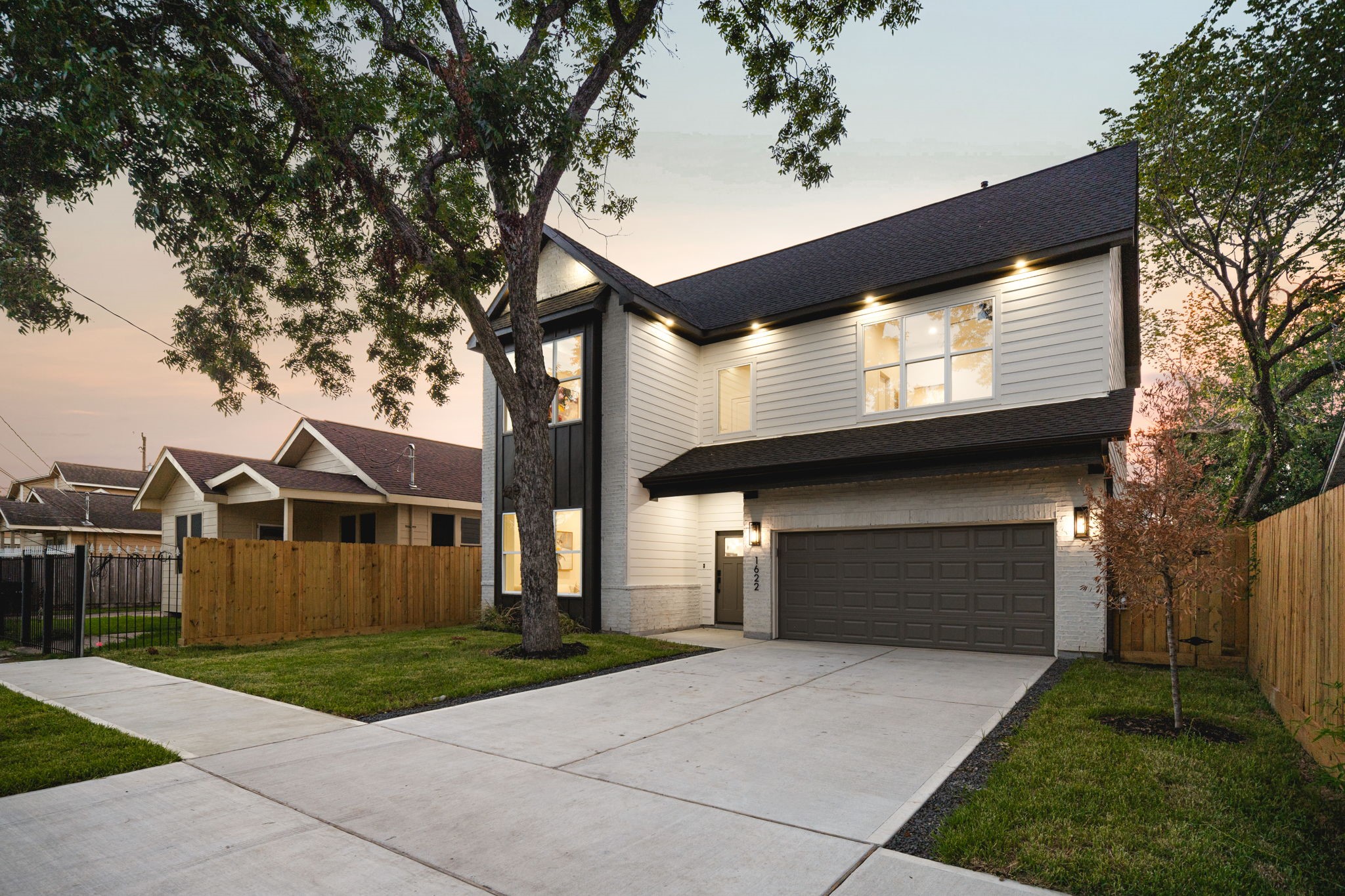 1622 Mable Street Houston, TX 77023 - Photo 2 of 25 a front view of a house with a garden and garage