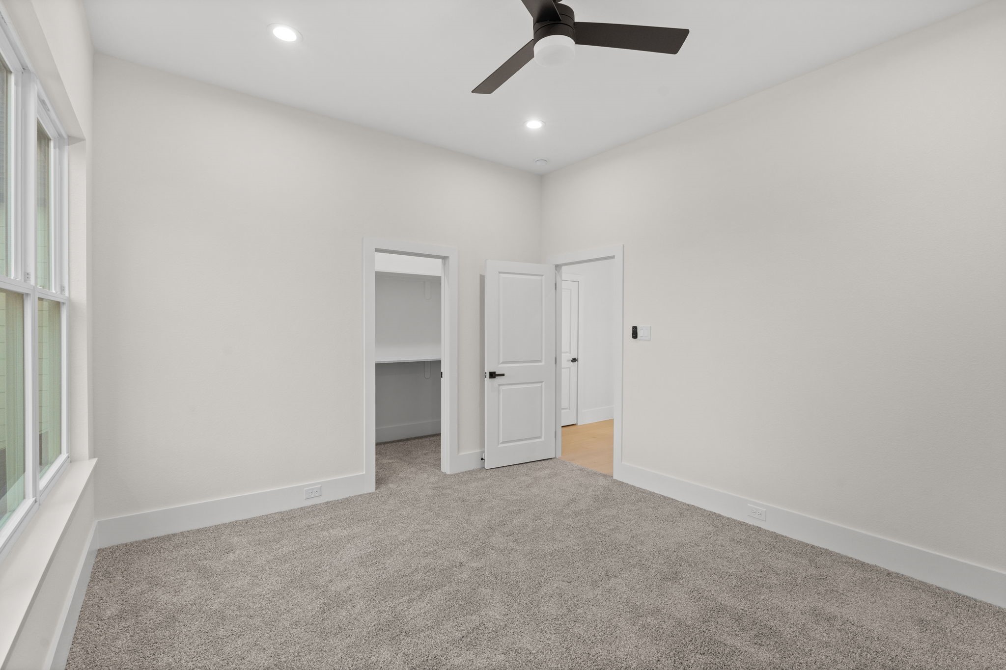 1622 Mable Street Houston, TX 77023 - Photo 24 of 25 an empty room with a ceiling fan and window