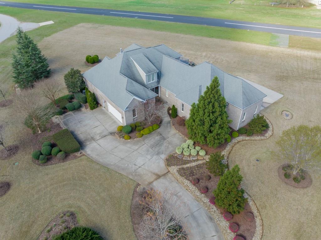 180 Chandelle Ridge Drive Woodruff, SC 29388 - Photo 11 of 48 an aerial view of a house with a yard and a garden