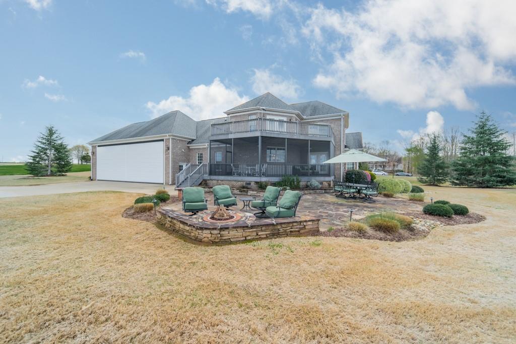 180 Chandelle Ridge Drive Woodruff, SC 29388 - Photo 17 of 48 a front view of house with yard and seating
