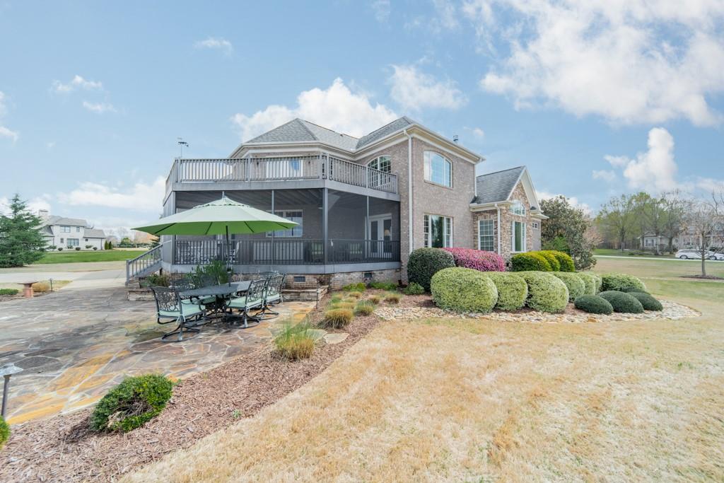 180 Chandelle Ridge Drive Woodruff, SC 29388 - Photo 19 of 48 a view of a house with backyard and sitting area
