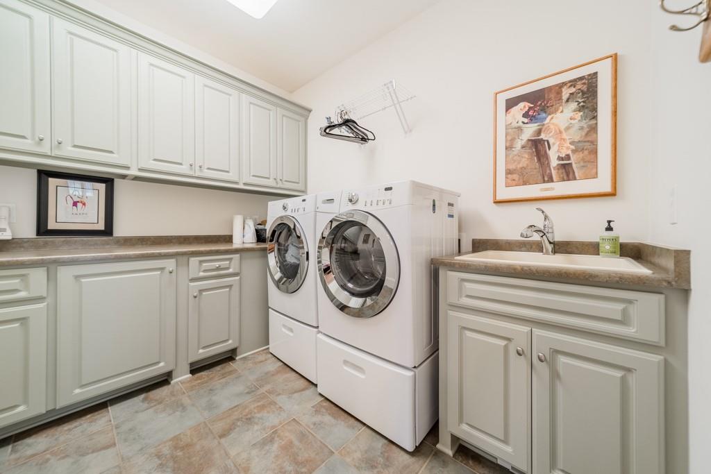 180 Chandelle Ridge Drive Woodruff, SC 29388 - Photo 30 of 48 a utility room with sink dryer and washer