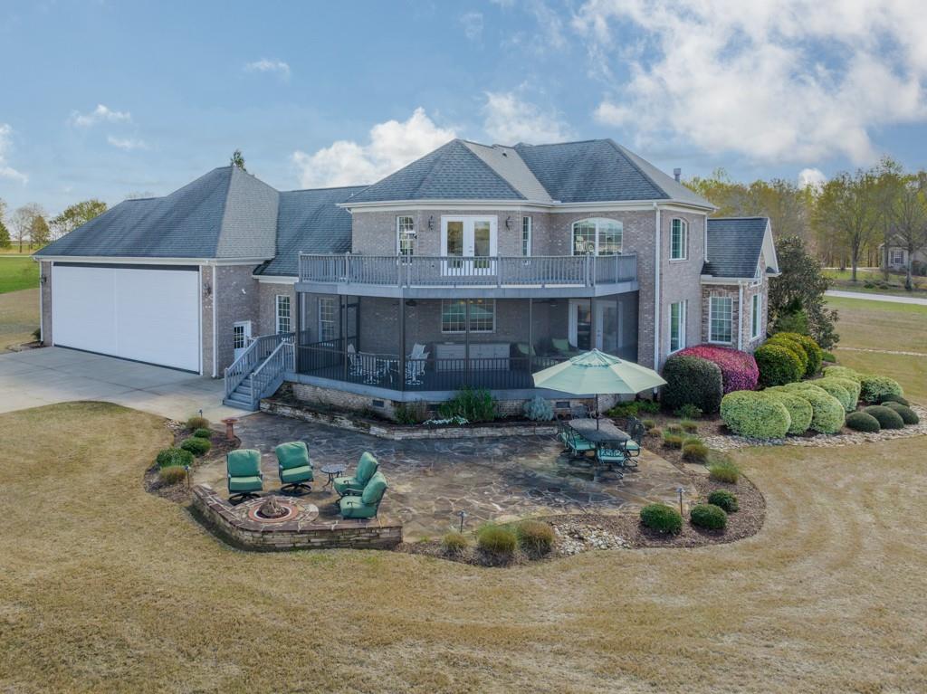 180 Chandelle Ridge Drive Woodruff, SC 29388 - Photo 3 of 48 a view of a house with backyard and sitting area