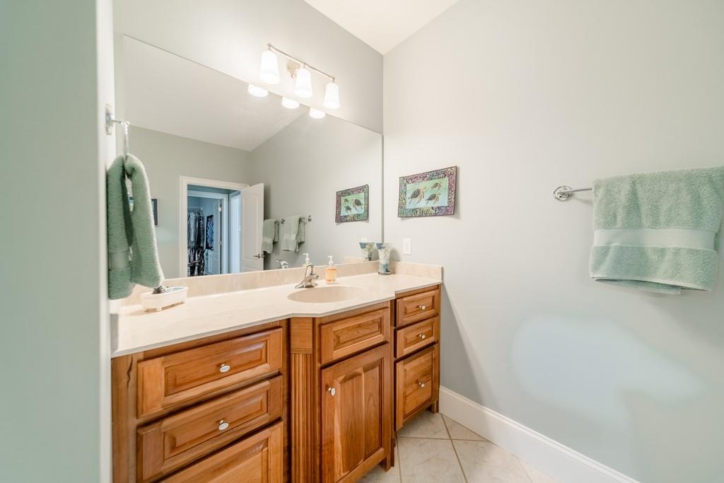 180 Chandelle Ridge Drive Woodruff, SC 29388 - Photo 34 of 48 a bathroom with a sink a vanity and a mirror