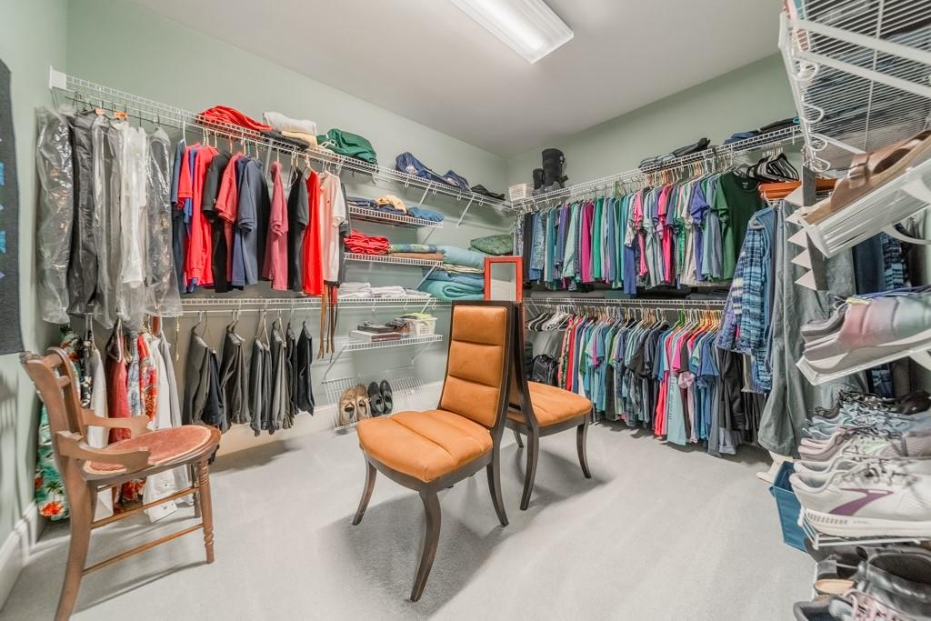 180 Chandelle Ridge Drive Woodruff, SC 29388 - Photo 35 of 48 a view of walk in closet with clothes shoes and a rug