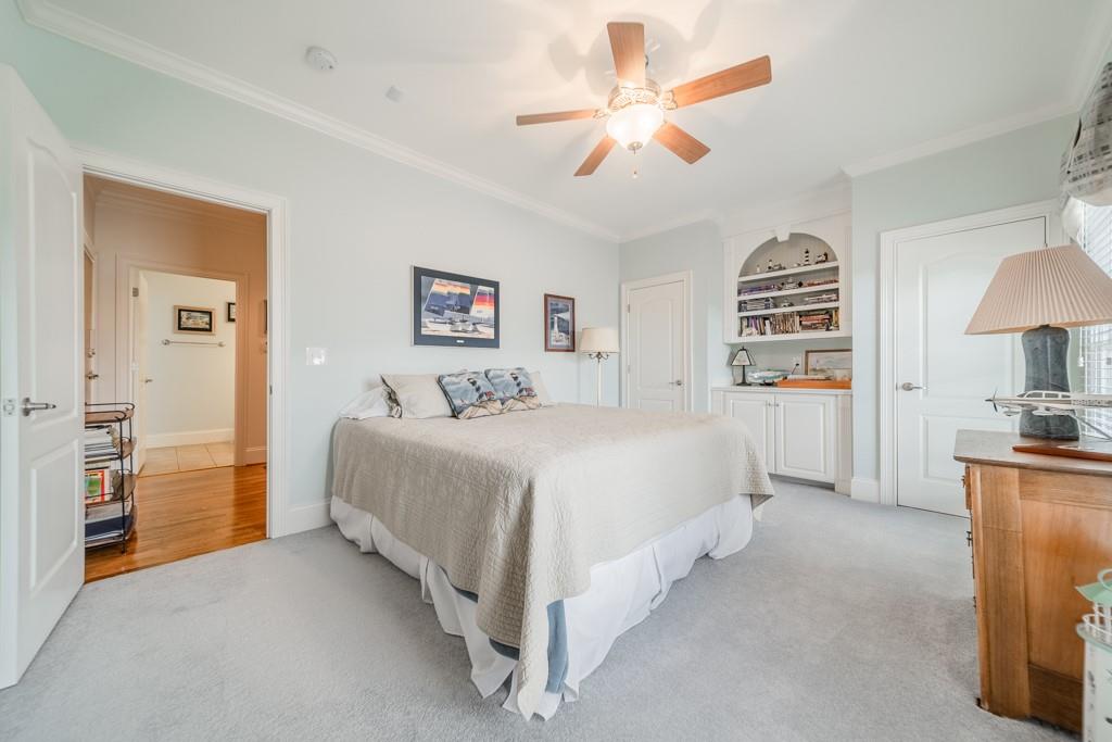 180 Chandelle Ridge Drive Woodruff, SC 29388 - Photo 37 of 48 a spacious bedroom with a bed and a chandelier