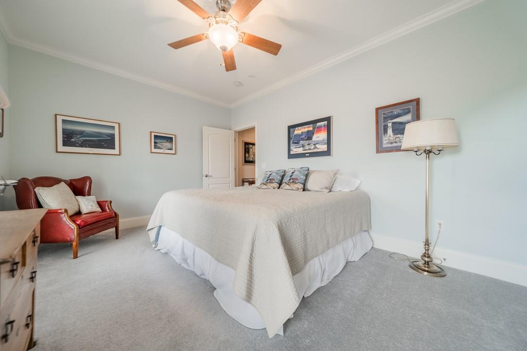 180 Chandelle Ridge Drive Woodruff, SC 29388 - Photo 38 of 48 a bedroom with a bed and a chandelier