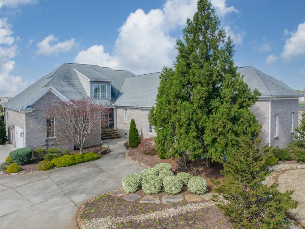 180 Chandelle Ridge Drive Woodruff, SC 29388 - Photo 5 of 48 a view of a garden with potted plants