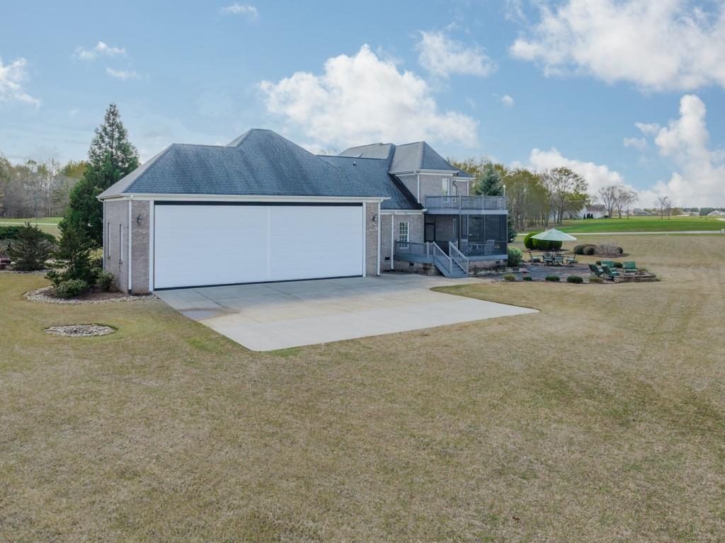 180 Chandelle Ridge Drive Woodruff, SC 29388 - Photo 9 of 48 a view of a house with a yard and garage
