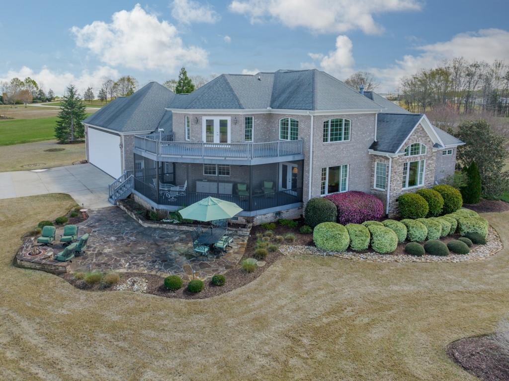 180 Chandelle Ridge Drive Woodruff, SC 29388 - Photo 10 of 48 a view of a house with a backyard and sitting area