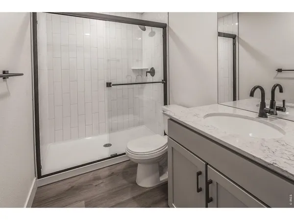a view of kitchen with wooden floor