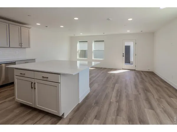 a kitchen with white cabinets