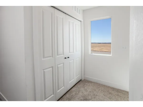 a view of house with backyard and tub