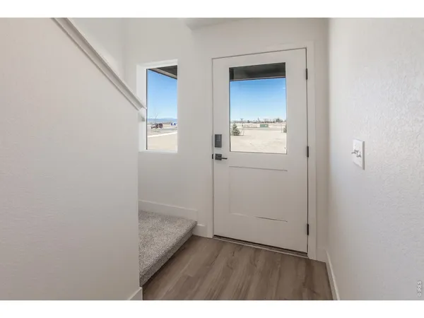 a bathroom with a granite countertop sink a toilet and shower