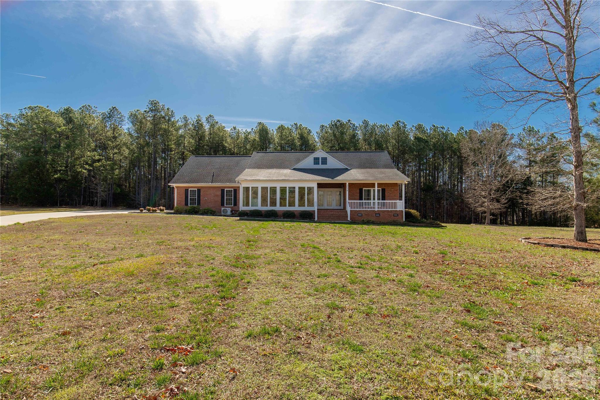 3034 Mulberry Lane Lancaster, SC 29720 - Photo 1 of 30 a front view of a house with a garden