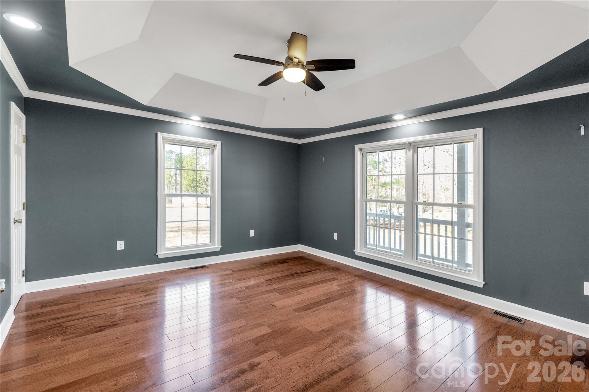 3034 Mulberry Lane Lancaster, SC 29720 - Photo 12 of 30 a view of an empty room with a window and wooden floor