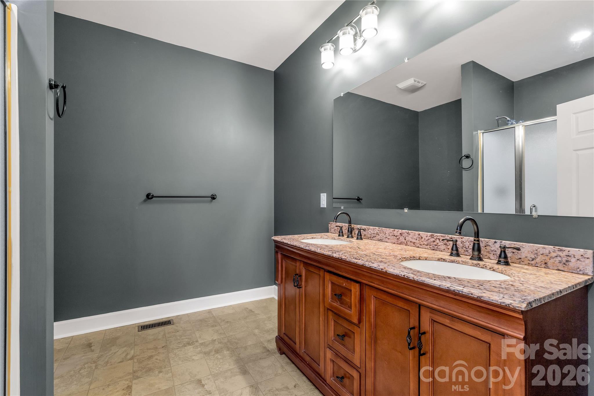3034 Mulberry Lane Lancaster, SC 29720 - Photo 17 of 30 a bathroom with a sink double vanity and a mirror
