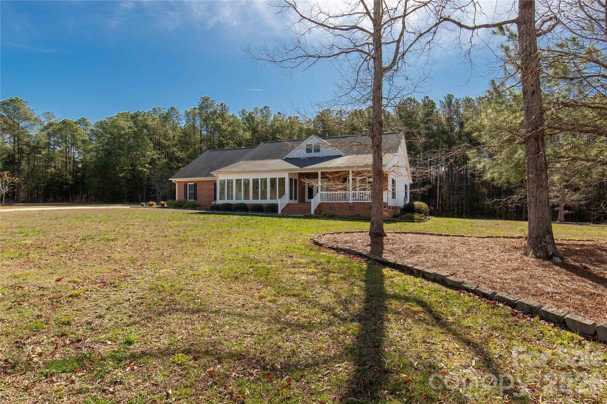 3034 Mulberry Lane Lancaster, SC 29720 - Photo 25 of 30 a view of a house with swimming pool next to a yard
