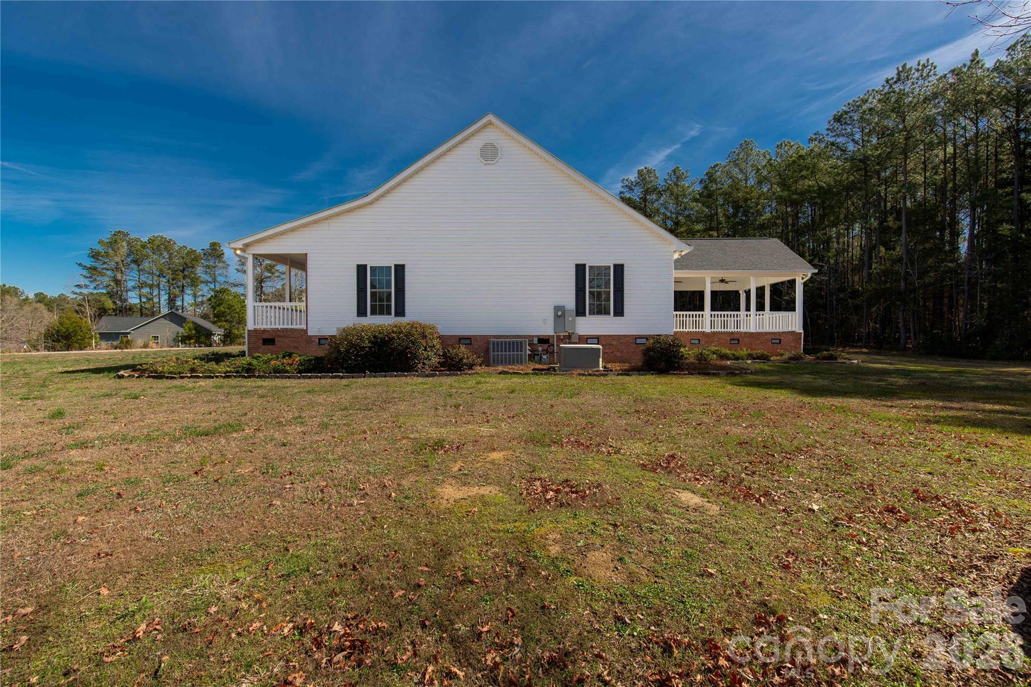 3034 Mulberry Lane Lancaster, SC 29720 - Photo 28 of 30 a front view of house with yard and trees in the background