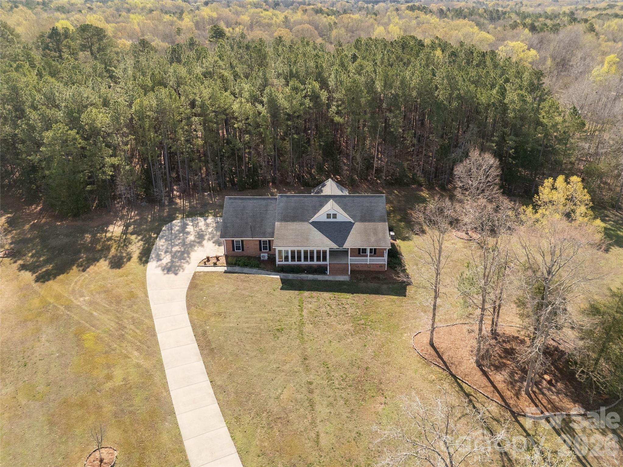 3034 Mulberry Lane Lancaster, SC 29720 - Photo 30 of 30 a swimming pool with trees in the background