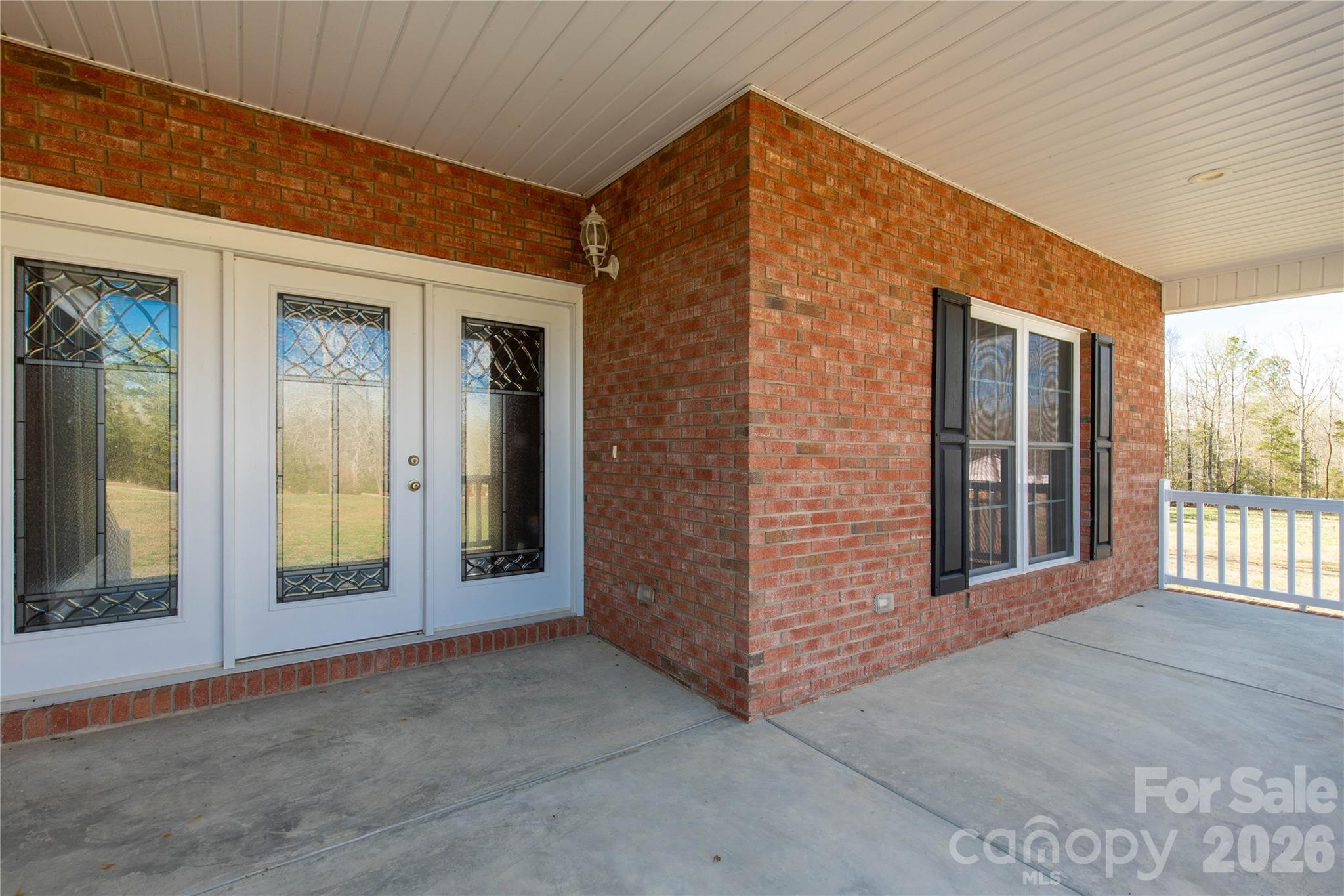 3034 Mulberry Lane Lancaster, SC 29720 - Photo 3 of 30 a view of a brick house with large windows