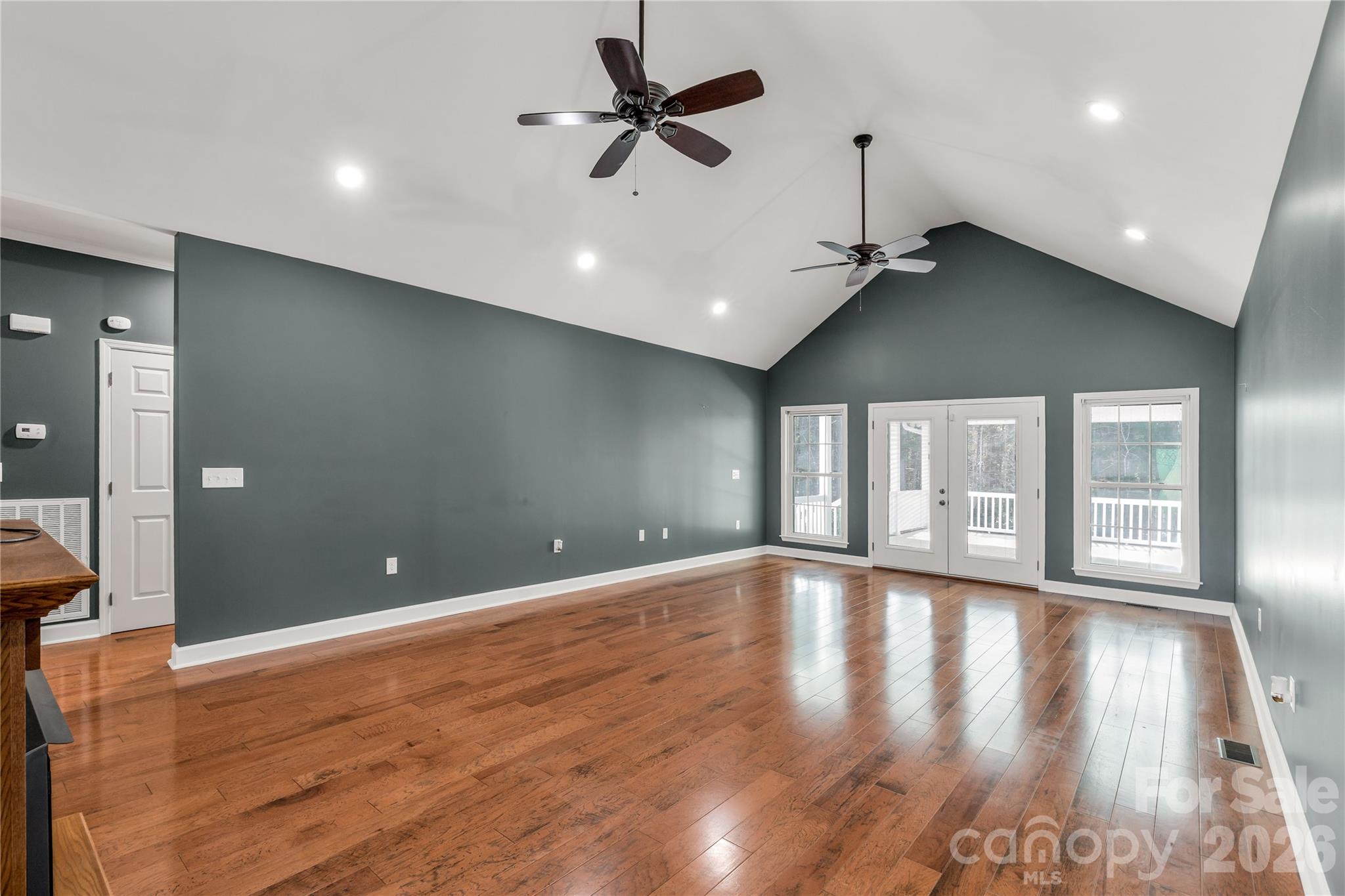 3034 Mulberry Lane Lancaster, SC 29720 - Photo 5 of 30 a view of an empty room with a window and wooden floor