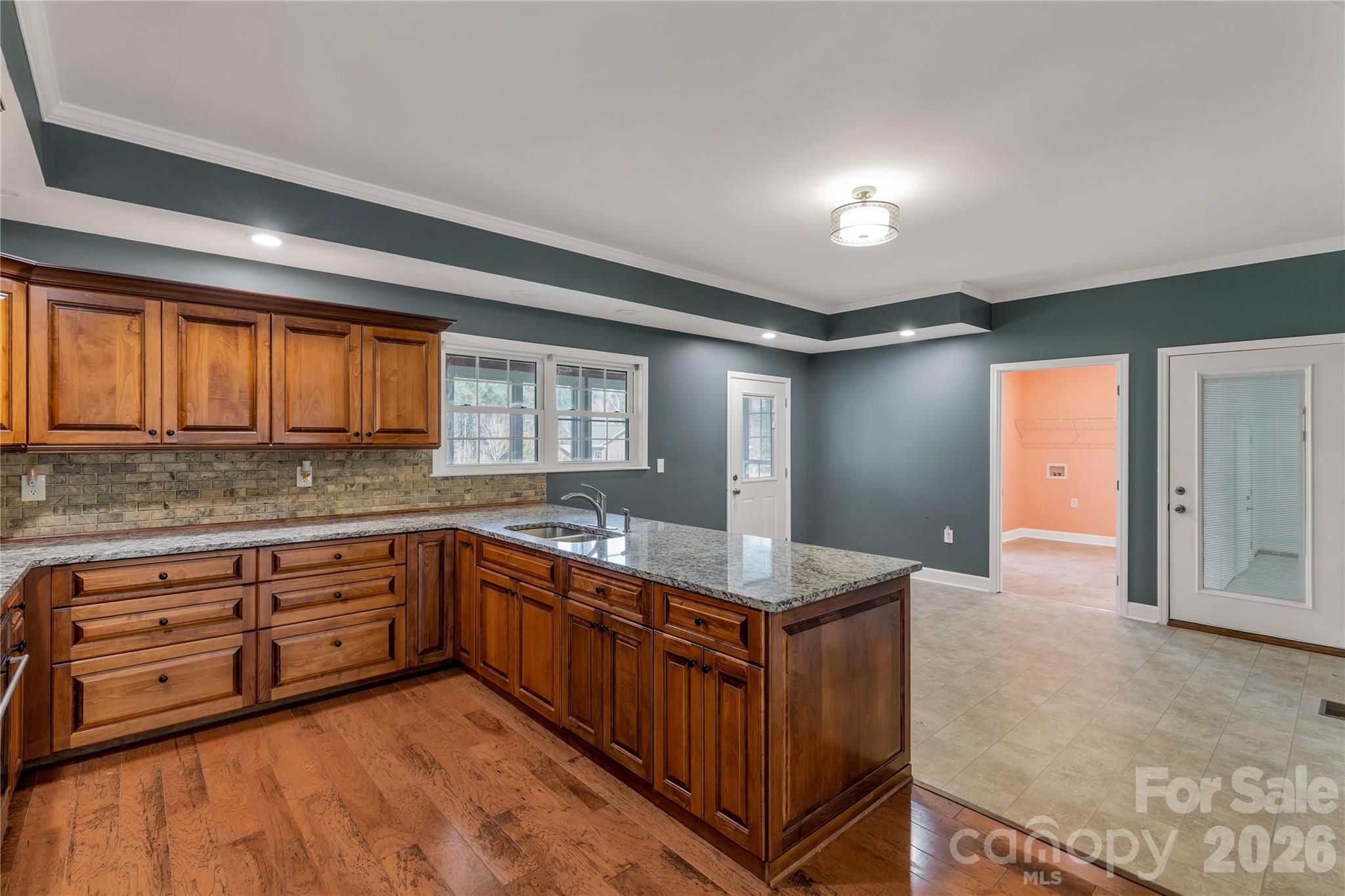 3034 Mulberry Lane Lancaster, SC 29720 - Photo 7 of 30 a kitchen with stainless steel appliances granite countertop a sink and cabinets