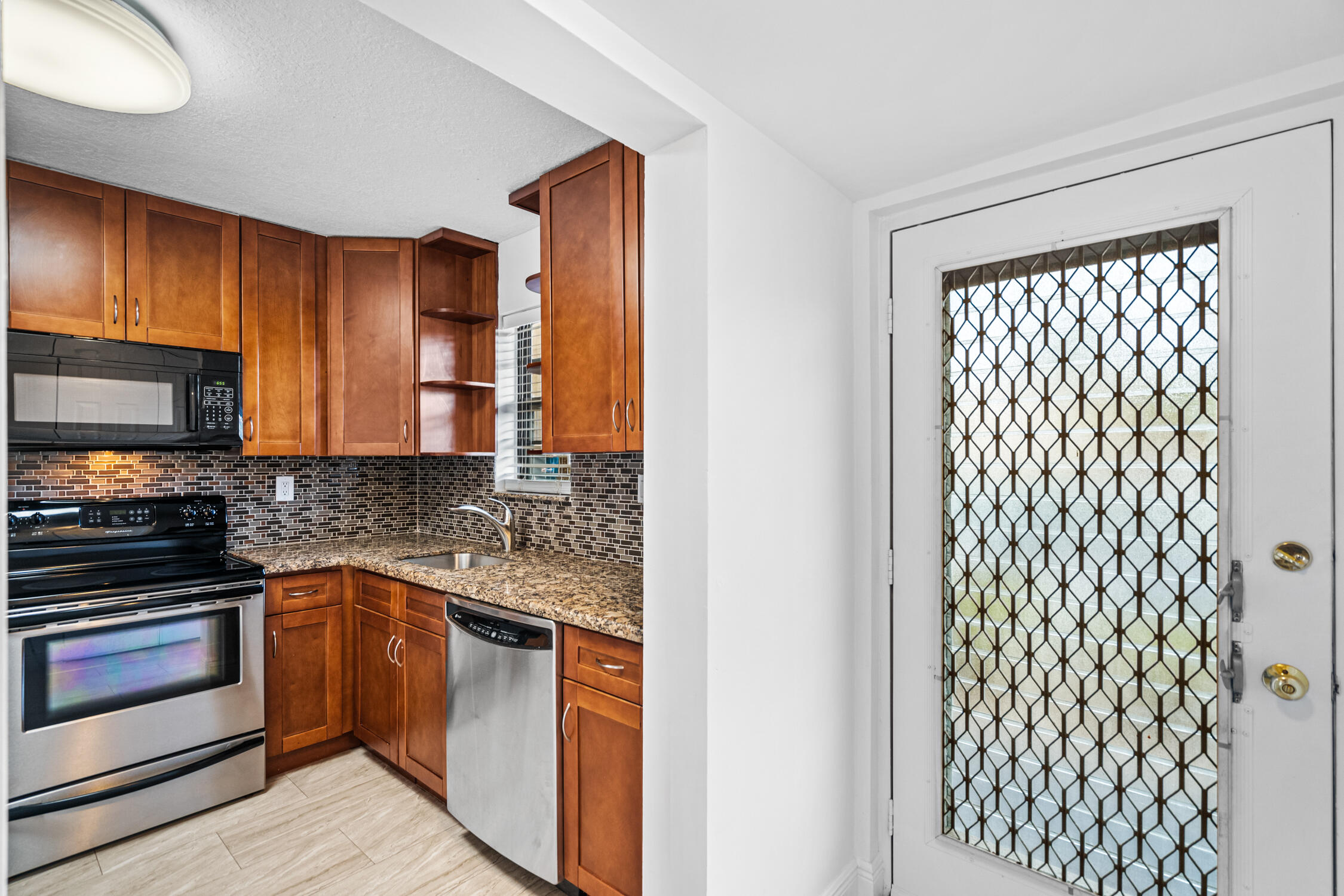 9370 Southwest 8th Street, Unit 111 Boca Raton, FL 33428 - Photo 2 of 26 Kitchen-Entry