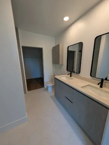 a bathroom with a shower and a glass door