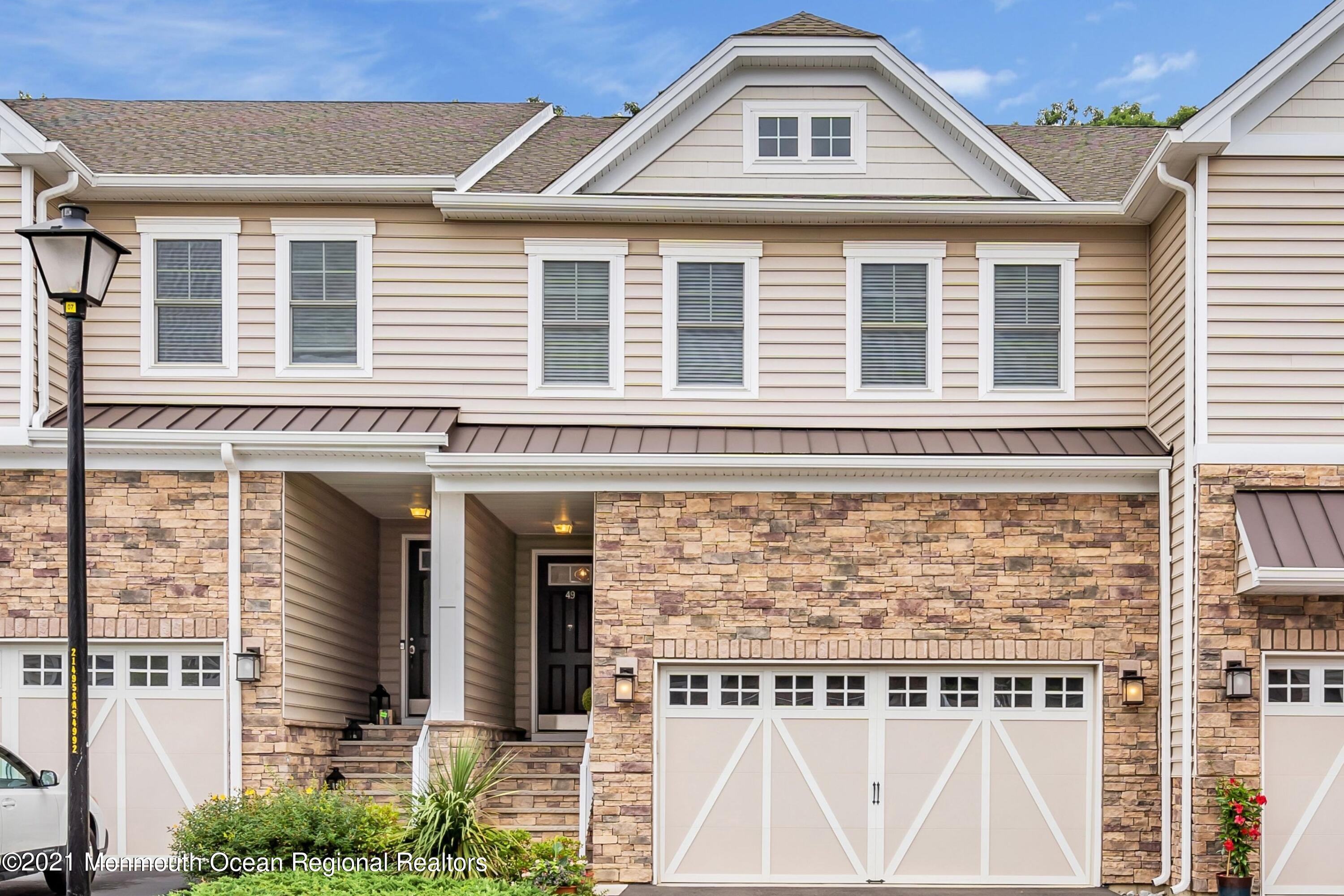 49 Eckert Drive, Unit 4404 Lincroft, NJ 07738 - Photo 1 of 42 a front view of a house with a yard