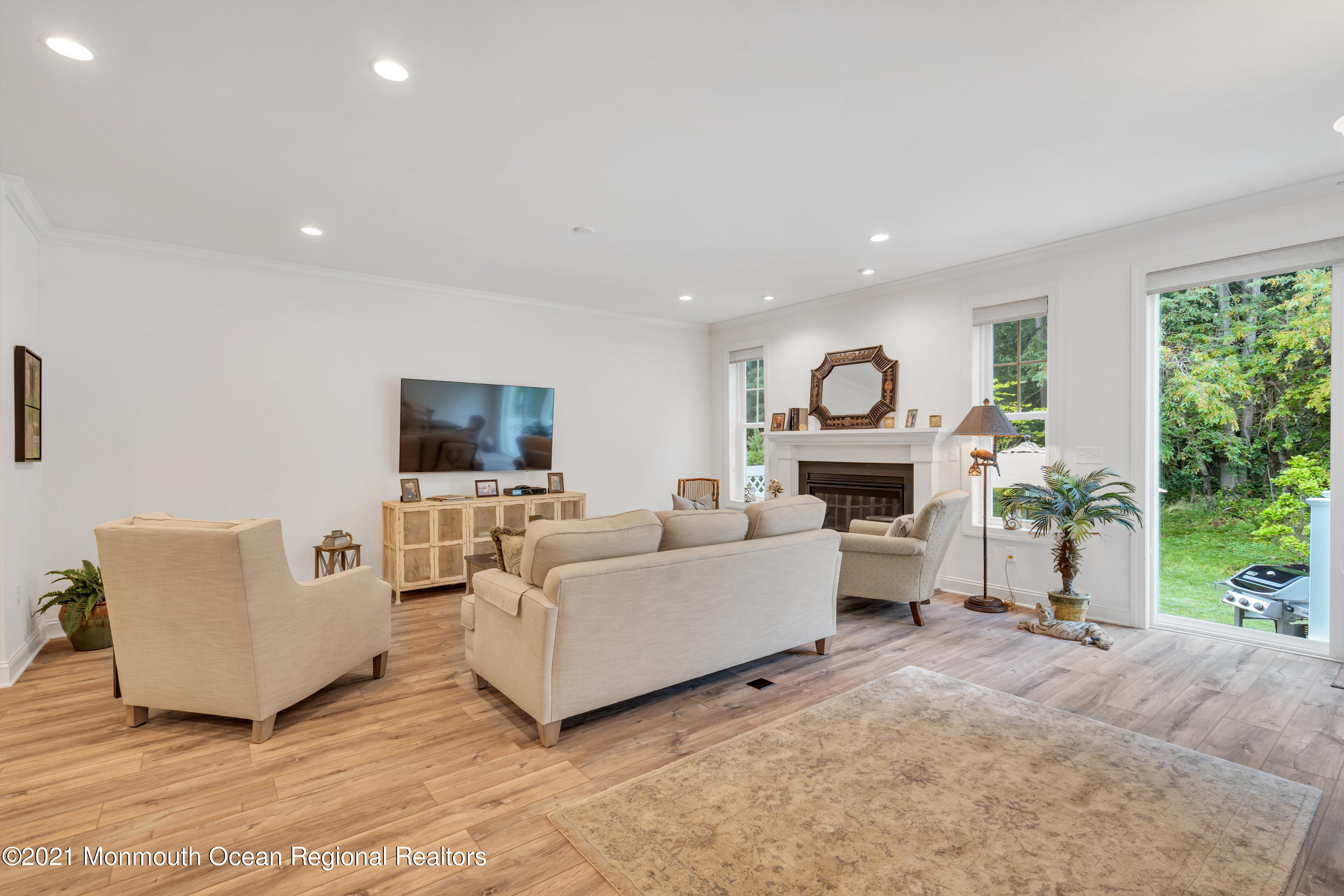 49 Eckert Drive, Unit 4404 Lincroft, NJ 07738 - Photo 14 of 42 a living room with furniture and a flat screen tv