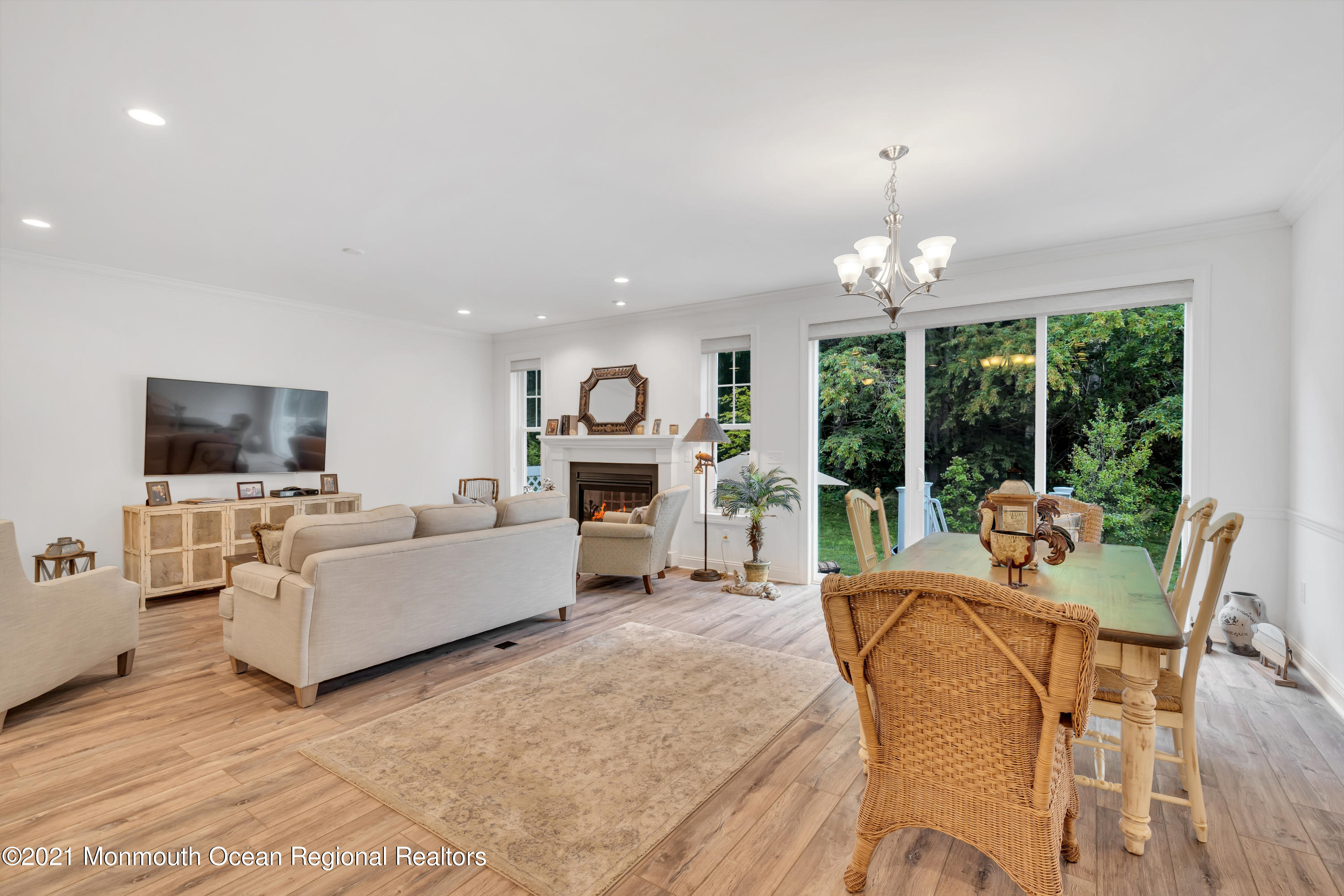 49 Eckert Drive, Unit 4404 Lincroft, NJ 07738 - Photo 19 of 42 a living room with furniture and a flat screen tv