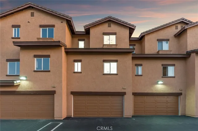 a front view of a house with garage