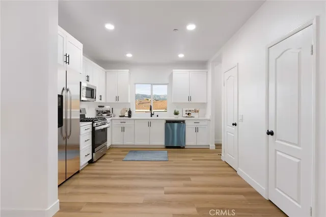 a view of a chair and table in a kitchen