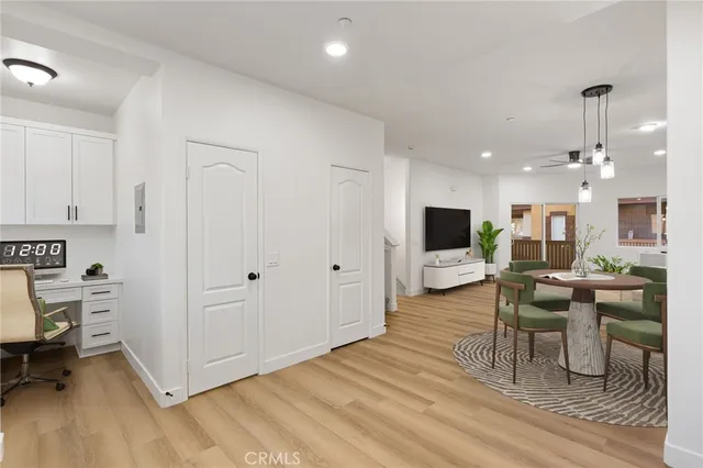 a view of a dining room with furniture and wooden floor
