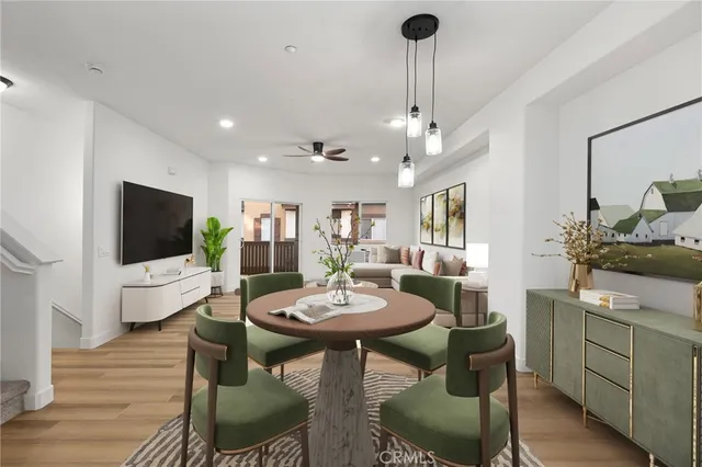 a bedroom with two beds and painting on the wall