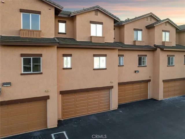 a view of a building with a yard