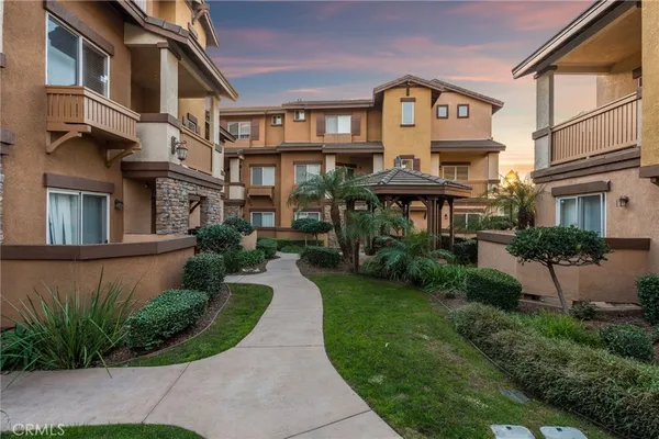 a view of a building with a yard