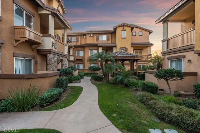 a view of a building with a yard