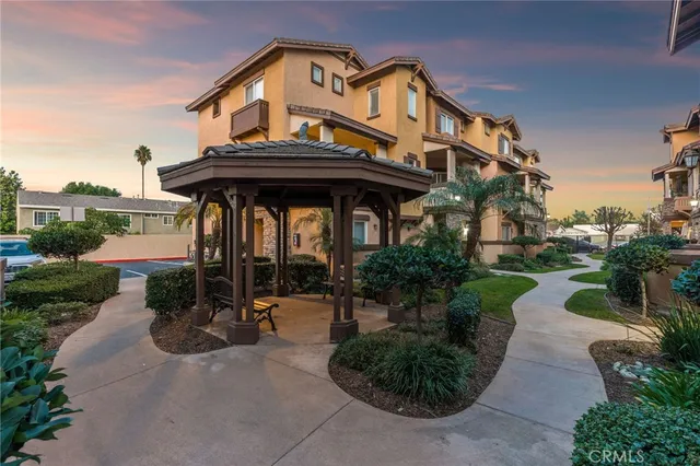 an aerial view of multiple houses with yard