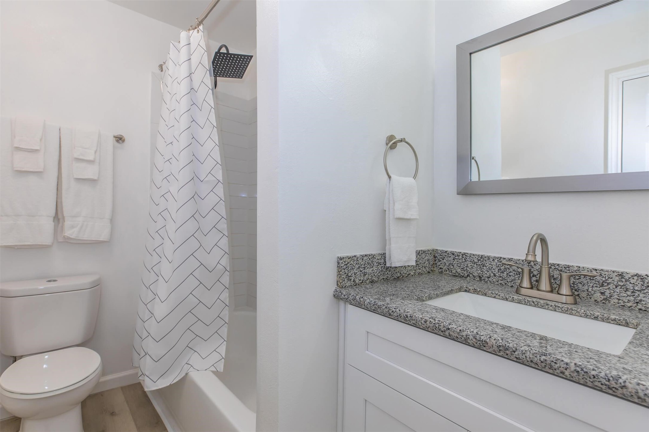 9707 Timberside Drive, Unit 2 Houston, TX 77025 - Photo 8 of 16 a bathroom with a granite countertop sink toilet and shower